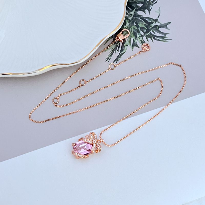 Necklace on a clean, light background, showcasing the crystal-covered present pendant in sharp detail. Alt: “Kate Spade New York Pave Present Pendant Necklace – Sparkling Gift Box Jewelry.”