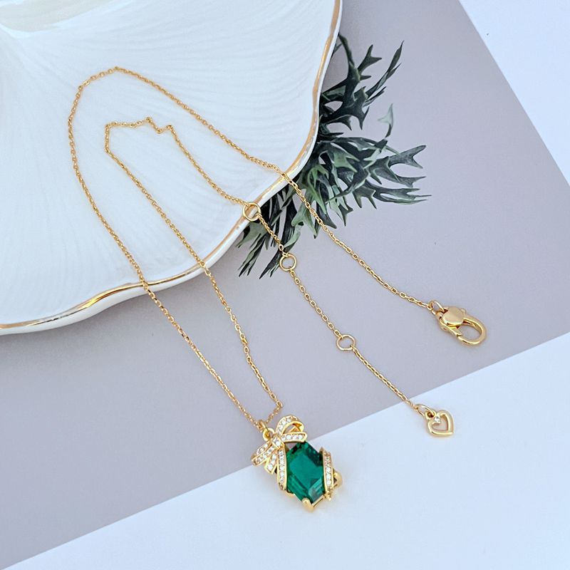 Necklace on a clean, light background, showcasing the crystal-covered present pendant in sharp detail. Alt: “Kate Spade New York Pave Present Pendant Necklace – Sparkling Gift Box Jewelry.”