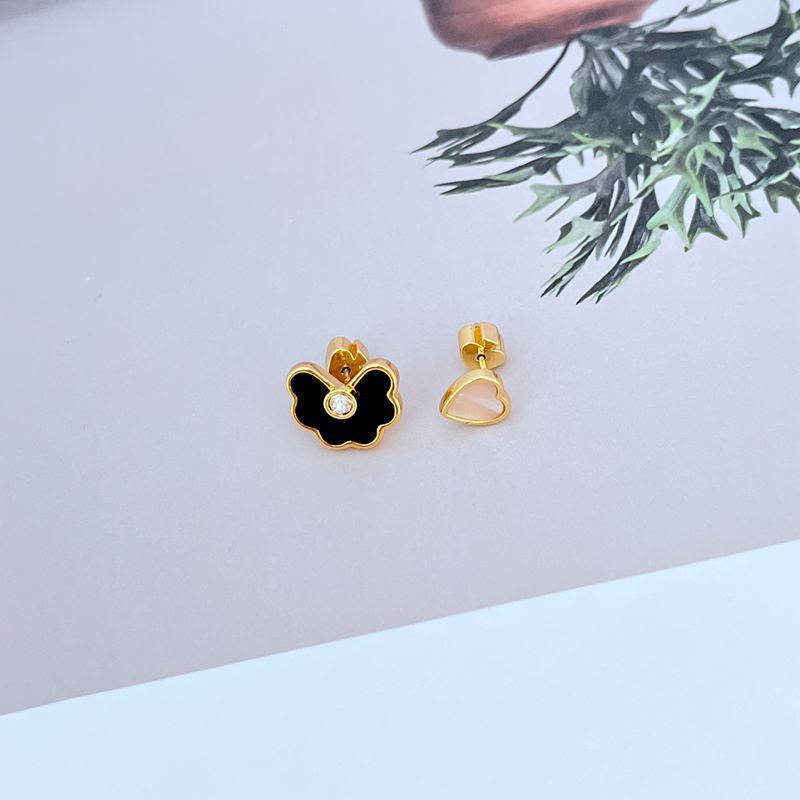 Earrings on soft seafoam or blush background. Alt: “Kate Spade Shell Love Heart Spade Flower Earrings – Enamel Charm Jewelry.”