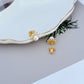 Necklace on a soft, bright background (light blue or creamy white), highlighting the sun pendant's pearl center and crystal halo. Alt: “Kate Spade Sunny Pave & Imitation Pearl Halo Necklace – Radiant Sun Motif Jewelry.”