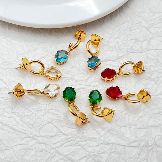 Earrings on a clean white or soft navy background, showcasing the huggie hoop and dangling charm. Alt: “Kate Spade Treasure Trove Drop Huggie Hoop Earrings – Gold Key Charm Earrings.”