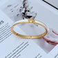 Bracelet on a clean white or light grey background, highlighting the pearl and crystal details. Alt: “Kate Spade New York White Bracelet – Pearl and Crystal Statement Jewelry.”