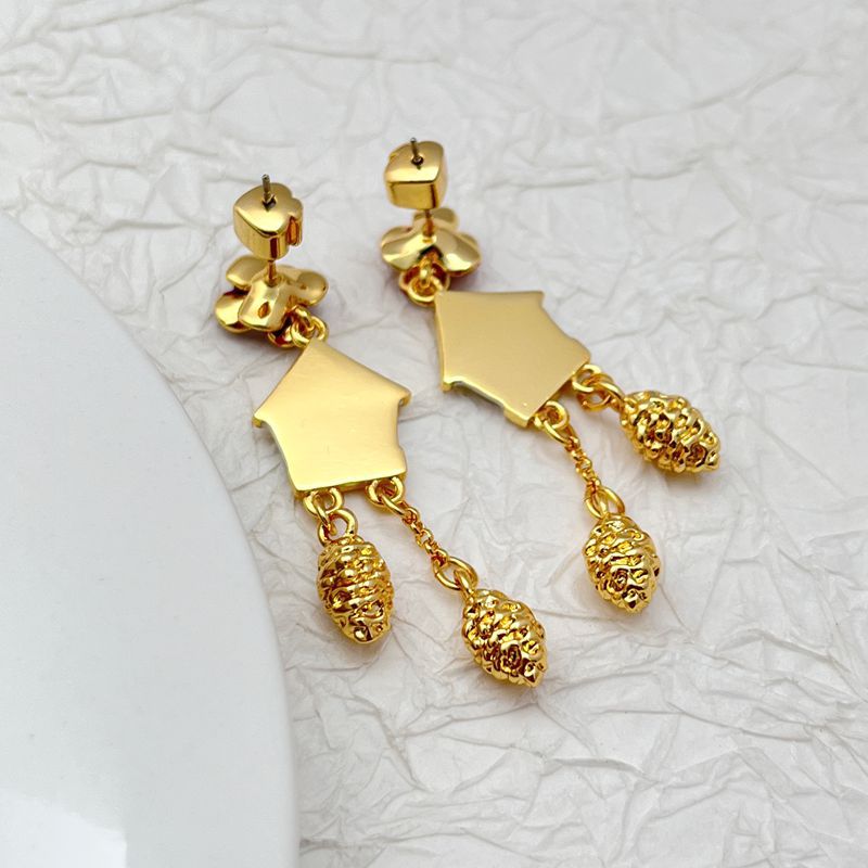 Earrings on a soft cream or French blue background, showcasing the miniature cuckoo clock charms with bird and pendulum details. Alt: “Kate Spade Ooh La La Cuckoo Clock Earrings NEW – Whimsical Enamel Drop Jewelry.”