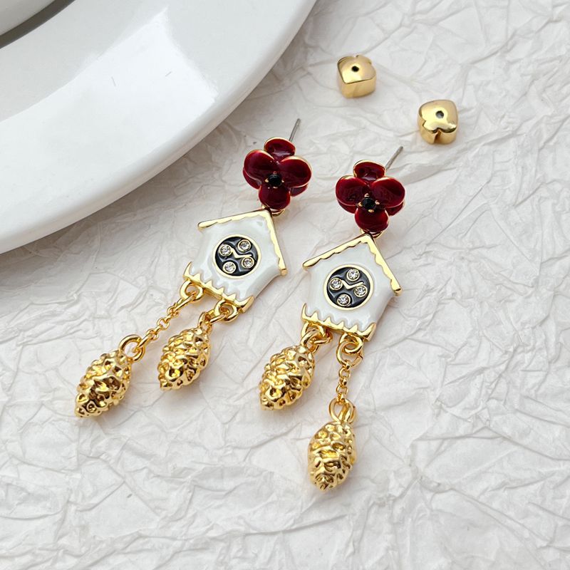 Earrings on a soft cream or French blue background, showcasing the miniature cuckoo clock charms with bird and pendulum details. Alt: “Kate Spade Ooh La La Cuckoo Clock Earrings NEW – Whimsical Enamel Drop Jewelry.”