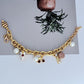 Bracelet displayed on a light marble or pastel backdrop, charms clearly visible. Alt: “Kate Spade Pastry Shop Charm Bracelet – Sweet Bakery-Themed Jewelry.”