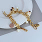  Bracelet displayed on a light marble or pastel backdrop, charms clearly visible. Alt: “Kate Spade Pastry Shop Charm Bracelet – Sweet Bakery-Themed Jewelry.”