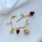  Bracelet displayed on a red gingham or soft cream background, evoking a classic picnic aesthetic. Alt: “Kate Spade Picnic Basket and Strawberry Bracelet – Summer Enamel Charm Jewelry.”