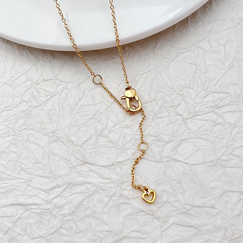 Clean, bright shot of the necklace on a solid, playful background, highlighting the detailed popcorn charm.