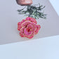  Ring on soft blush or velvet background. Alt: “Kate Spade Rosy Statement Ring – Pink Enamel Flower Jewelry.”