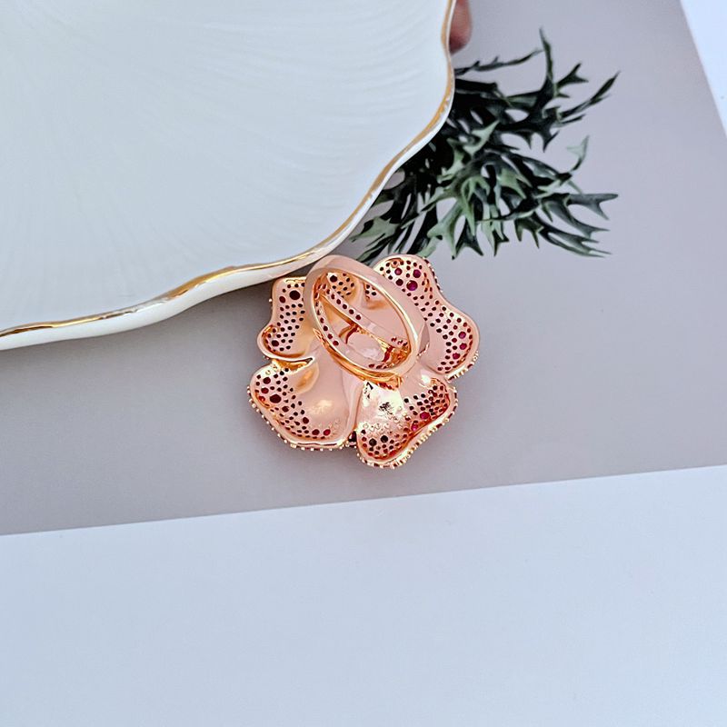  Ring on soft blush or velvet background. Alt: “Kate Spade Rosy Statement Ring – Pink Enamel Flower Jewelry.”