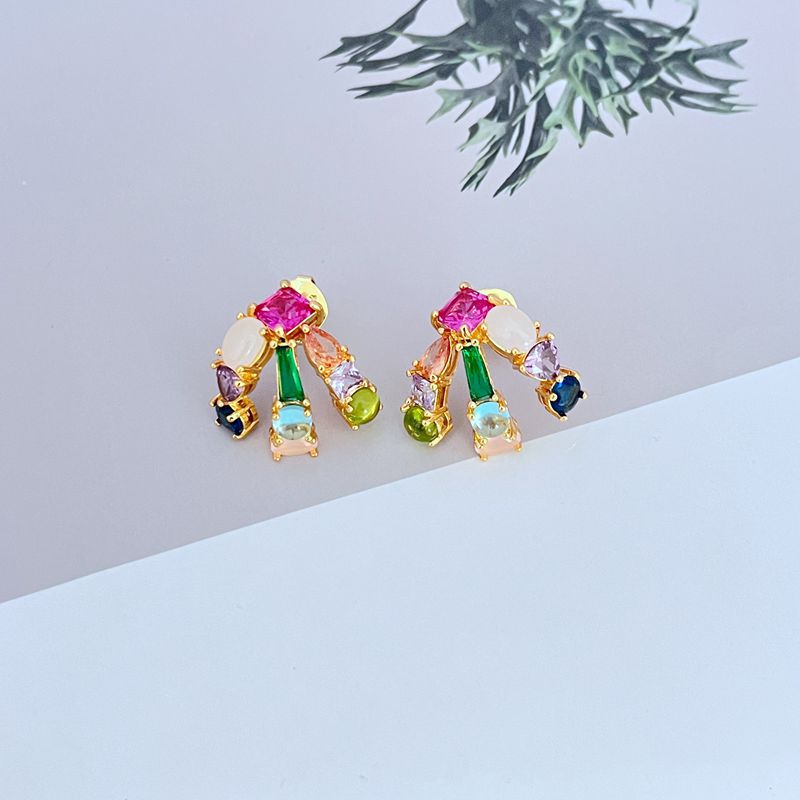 Earrings on a clean white or soft grey background, showcasing the crystal pavé along the huggie hoop. Alt: “Kate Spade Showtime Stud Huggie Hoops – Pavé Crystal Mini Hoop Earrings.”