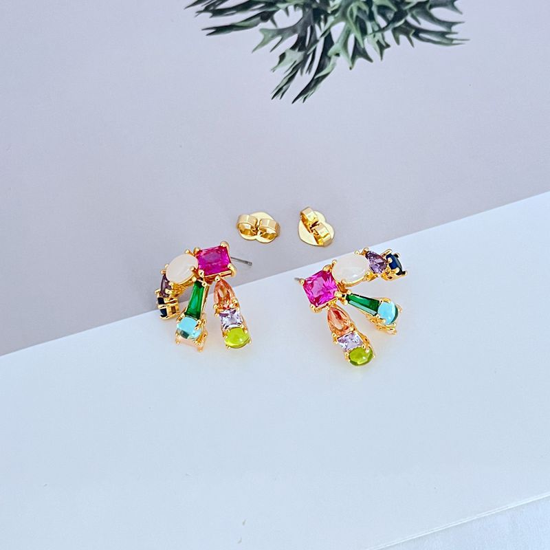 Earrings on a clean white or soft grey background, showcasing the crystal pavé along the huggie hoop. Alt: “Kate Spade Showtime Stud Huggie Hoops – Pavé Crystal Mini Hoop Earrings.”