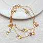Necklace displayed on a clean, light background, showcasing the layered chains and sparkling butterfly pendant. Alt: “Kate Spade Social Butterfly Double Strand Necklace – Crystal Butterfly Layered Jewelry.”