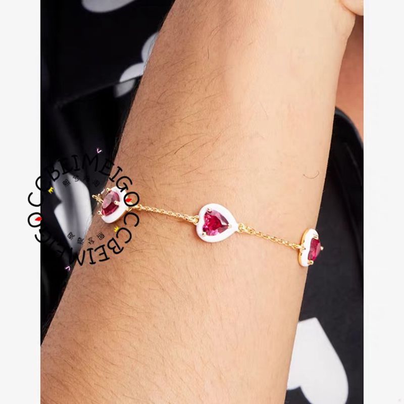  The bracelet styled next to a small bouquet of fresh flowers or a handwritten note, reinforcing the sweet, sentimental theme.