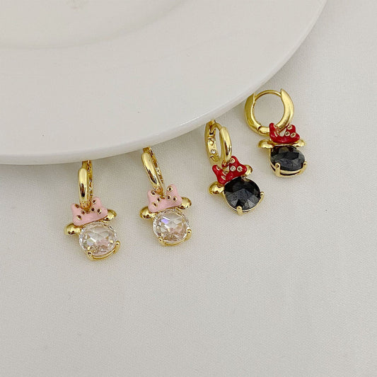 High-definition shot of the pair of earrings laid flat on pure white background, arranged symmetrically.