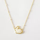 Clean, simple shot of the necklace laid flat or worn, against a plain background, clearly showing the cross pendant and chain.