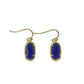  A woman with a calm, serene demeanor, wearing the earrings with a simple blouse or dress, capturing the gentle, feminine energy.