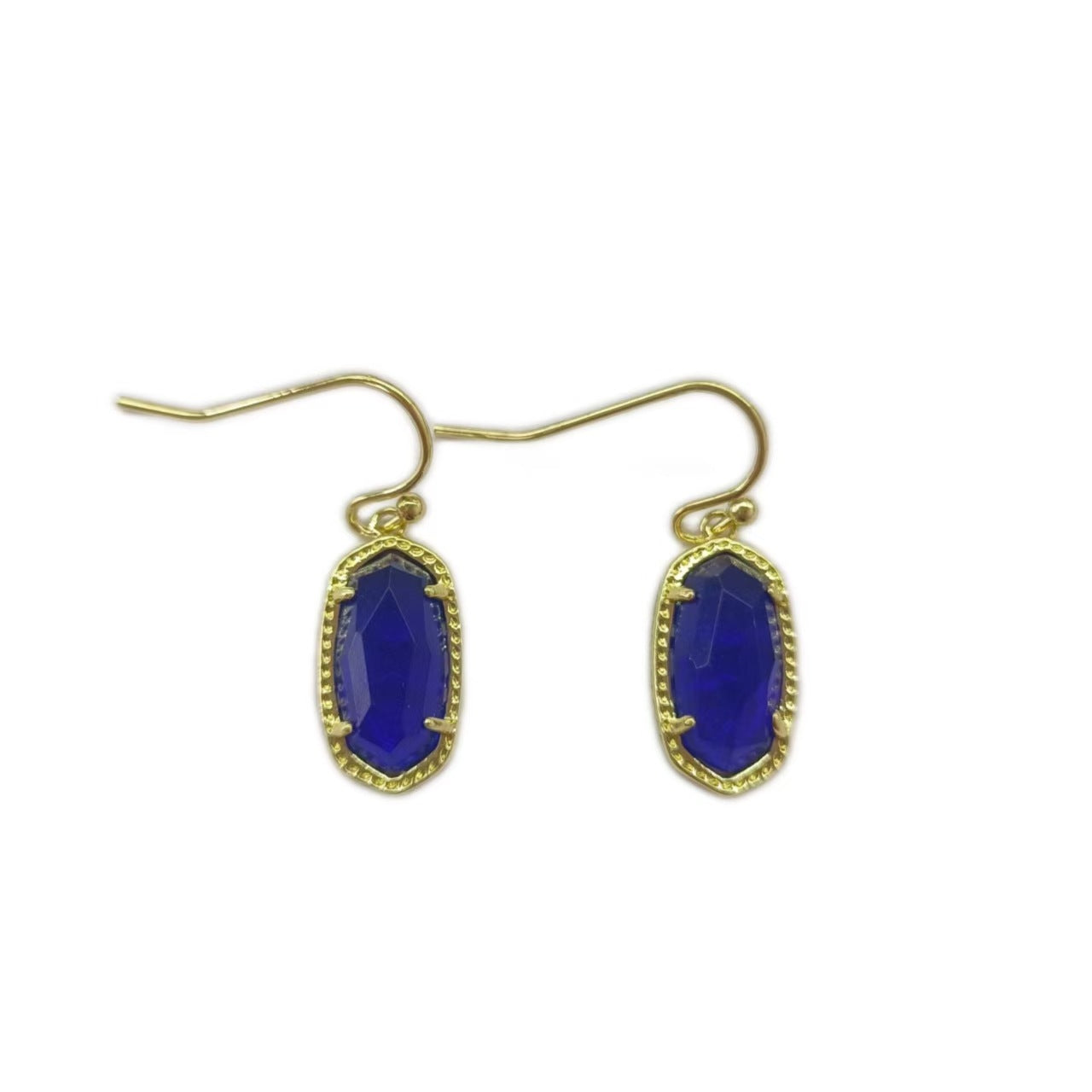  A woman with a calm, serene demeanor, wearing the earrings with a simple blouse or dress, capturing the gentle, feminine energy.