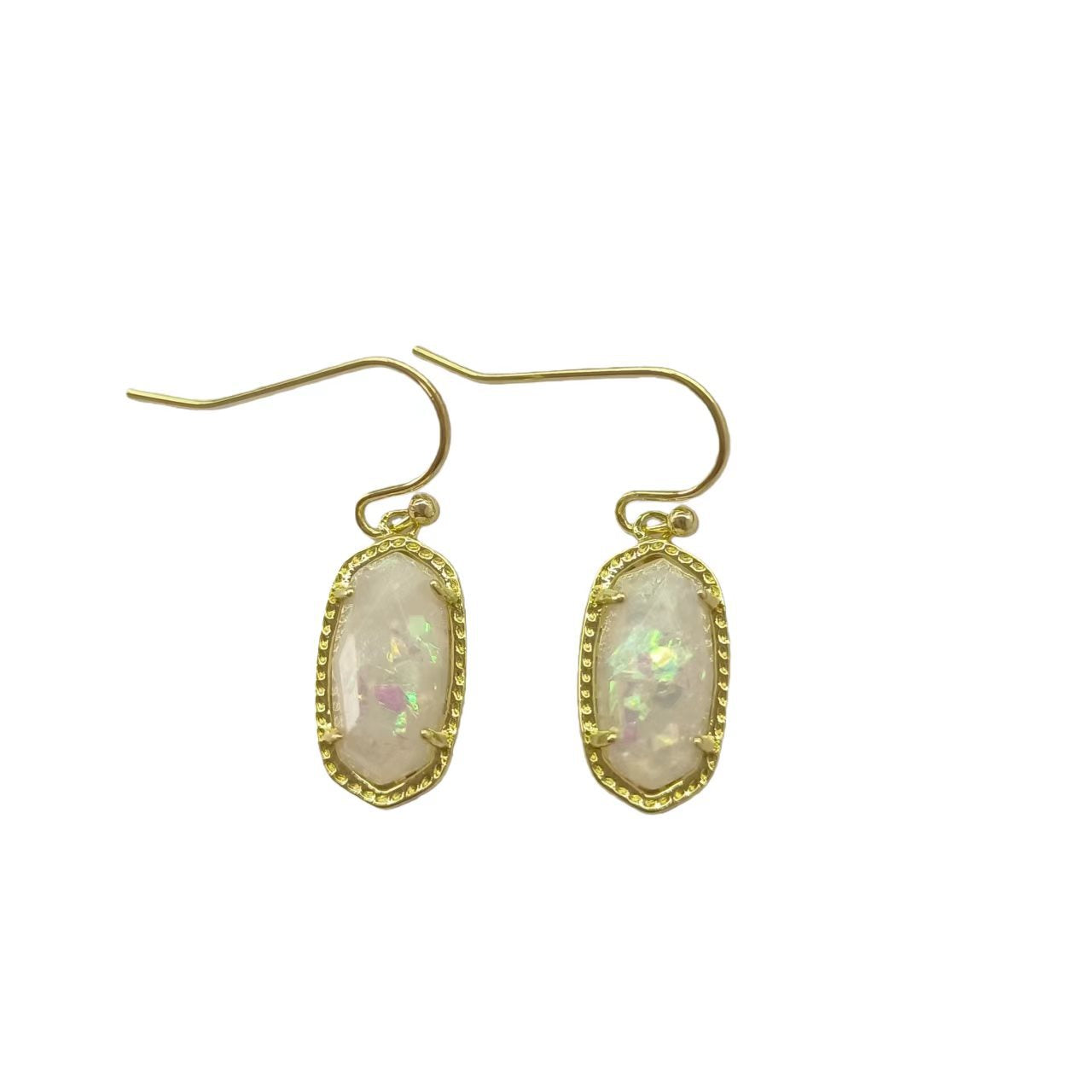  A woman with a calm, serene demeanor, wearing the earrings with a simple blouse or dress, capturing the gentle, feminine energy.