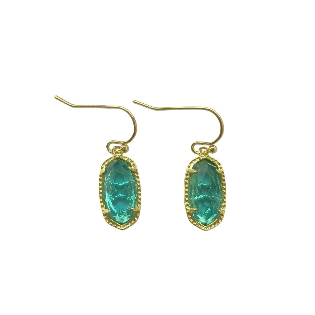  A woman with a calm, serene demeanor, wearing the earrings with a simple blouse or dress, capturing the gentle, feminine energy.