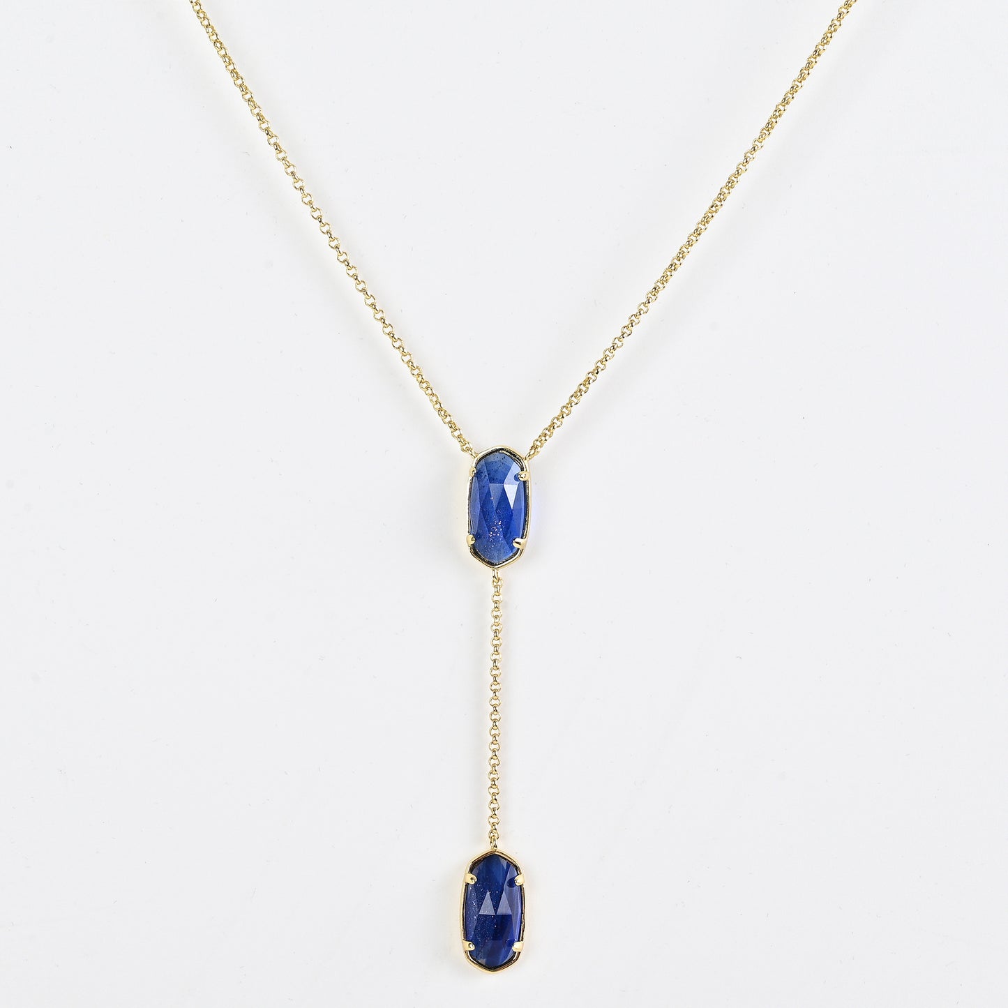 Clean shot of the necklace laid flat to show the Y-shape and pendant detail against a neutral background