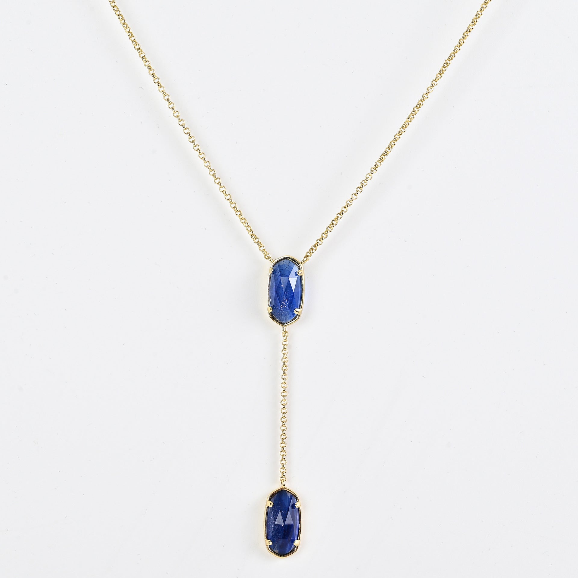 Clean shot of the necklace laid flat to show the Y-shape and pendant detail against a neutral background