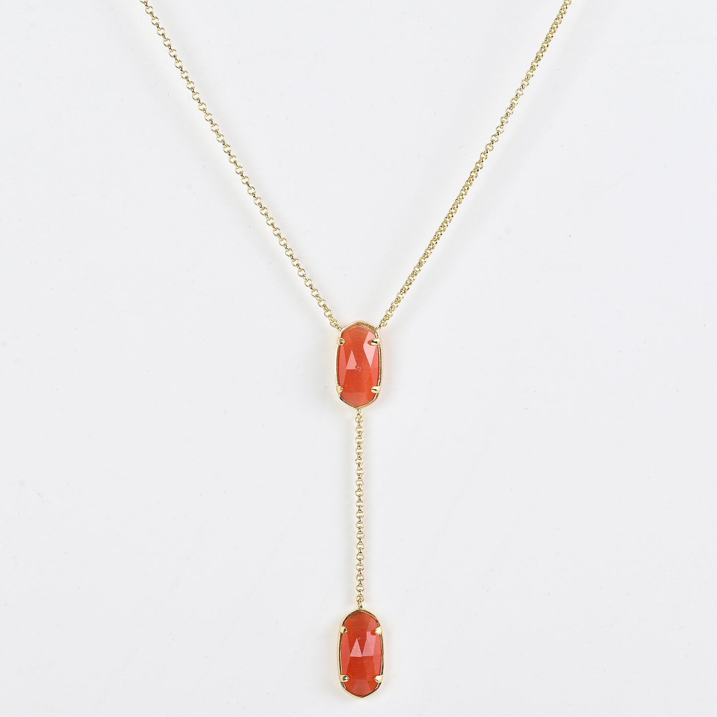 Clean shot of the necklace laid flat to show the Y-shape and pendant detail against a neutral background