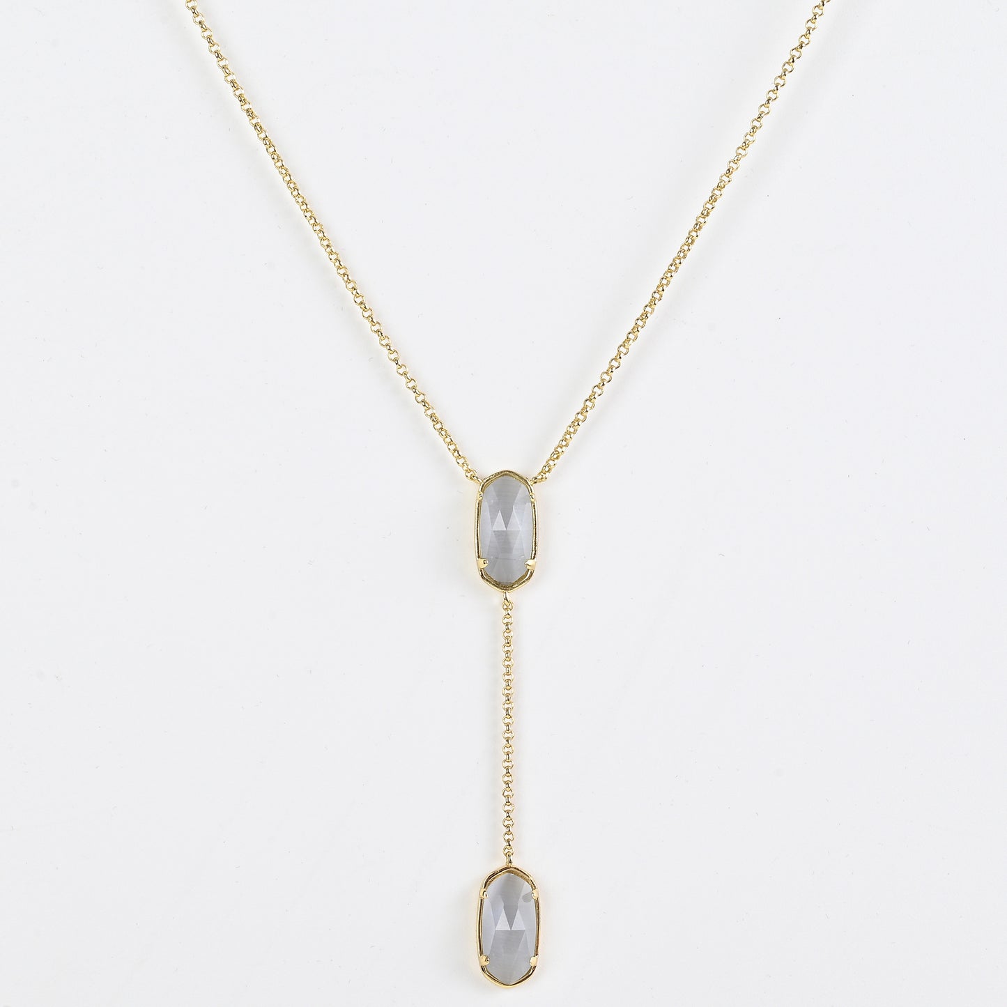 Clean shot of the necklace laid flat to show the Y-shape and pendant detail against a neutral background