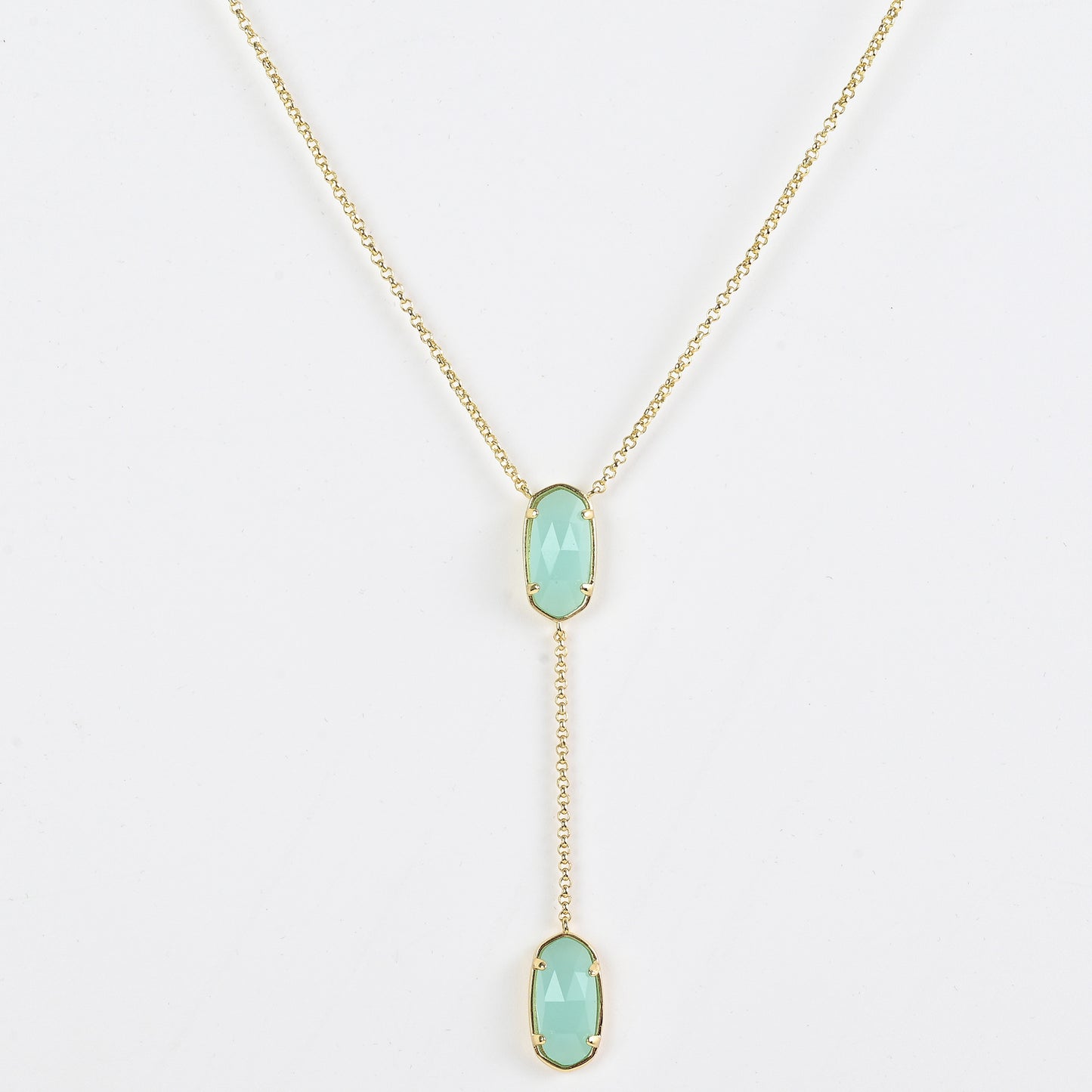 Clean shot of the necklace laid flat to show the Y-shape and pendant detail against a neutral background
