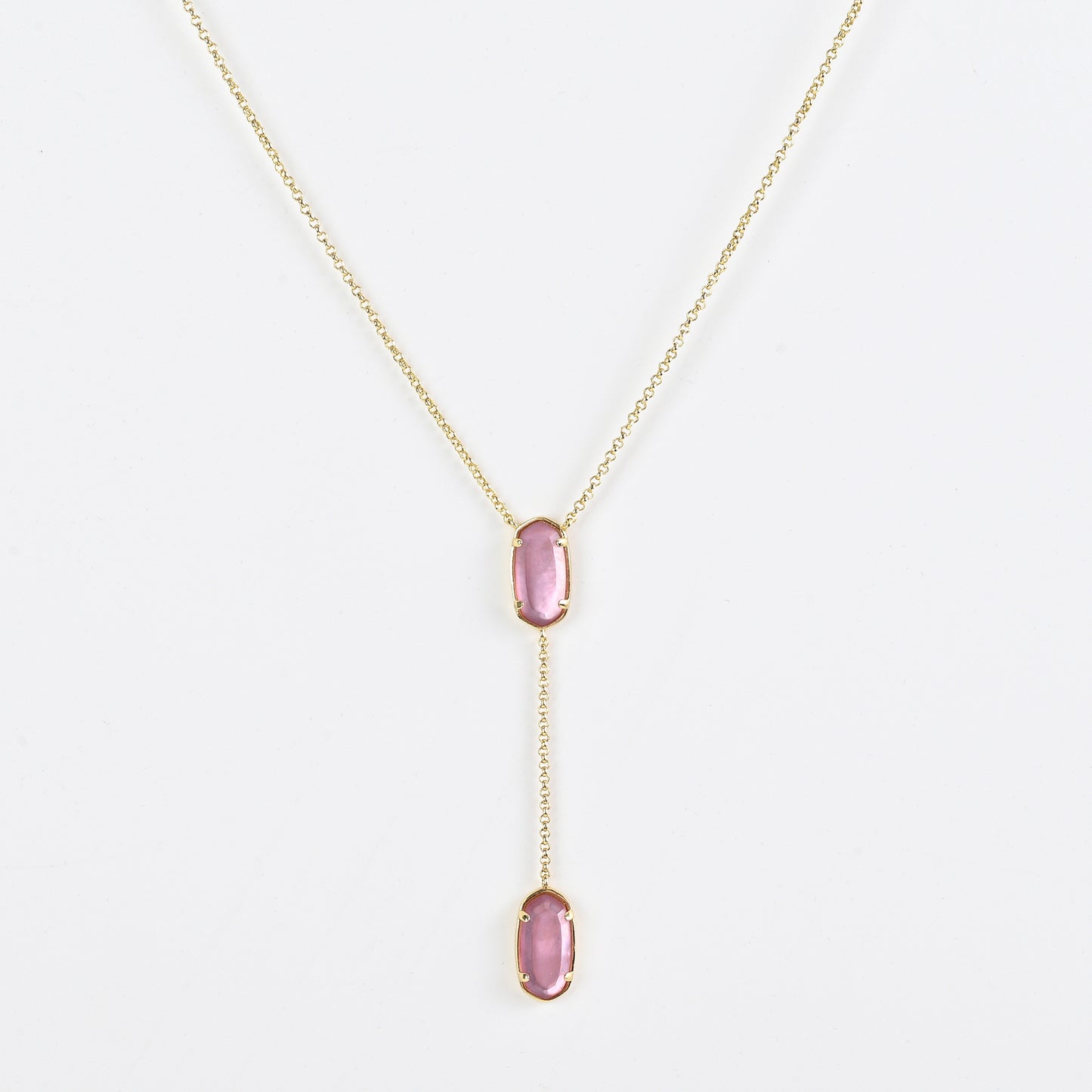 Clean shot of the necklace laid flat to show the Y-shape and pendant detail against a neutral background