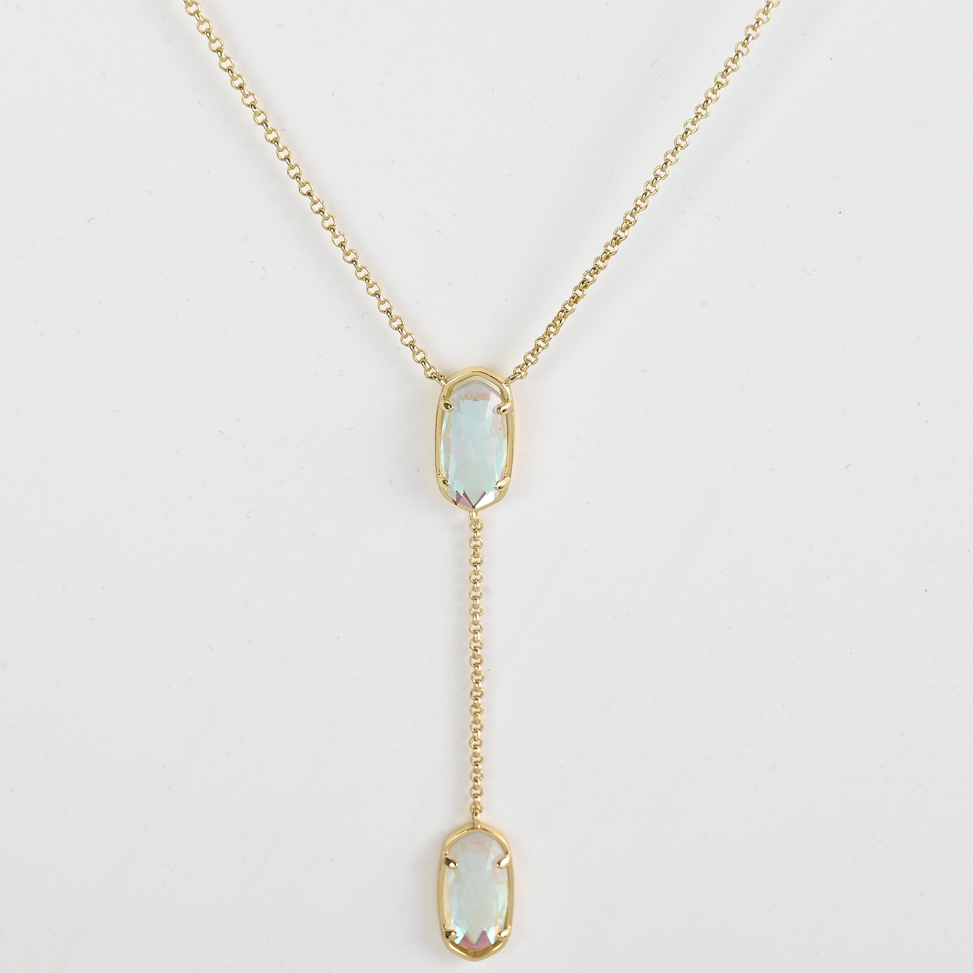 Clean shot of the necklace laid flat to show the Y-shape and pendant detail against a neutral background