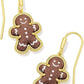 Macro shot focused on the gingerbread charm, showcasing the cute face, button details, and textured "icing" etchings.