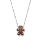 Festive shot of the necklace on a holiday-themed background (like a red velvet or plaid fabric), highlighting the charm.