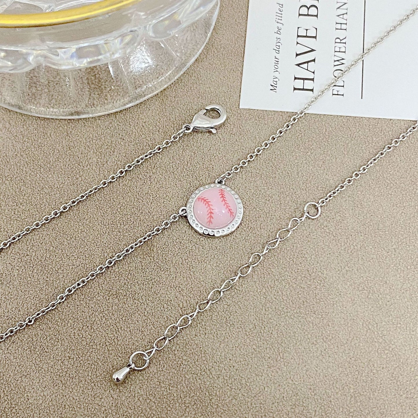 ZERRA Kendra Scott gold volleyball short pendant necklace with a delicate chain and small volleyball charm.