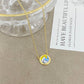 ZERRA Kendra Scott volleyball gold short pendant necklace with a delicate chain and small pendant, ideal for everyday wear.