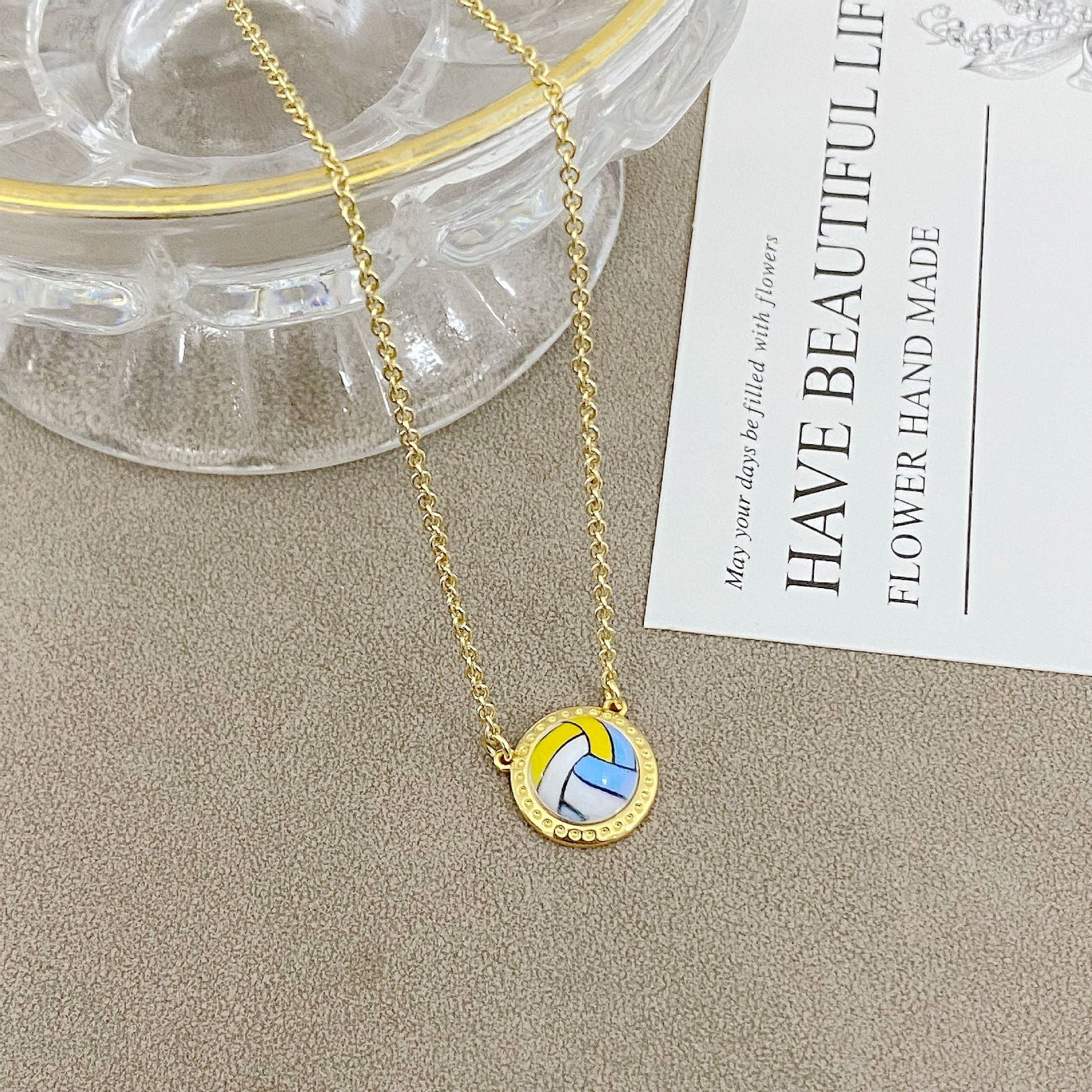 ZERRA Kendra Scott volleyball gold short pendant necklace with a delicate chain and small pendant, ideal for everyday wear.