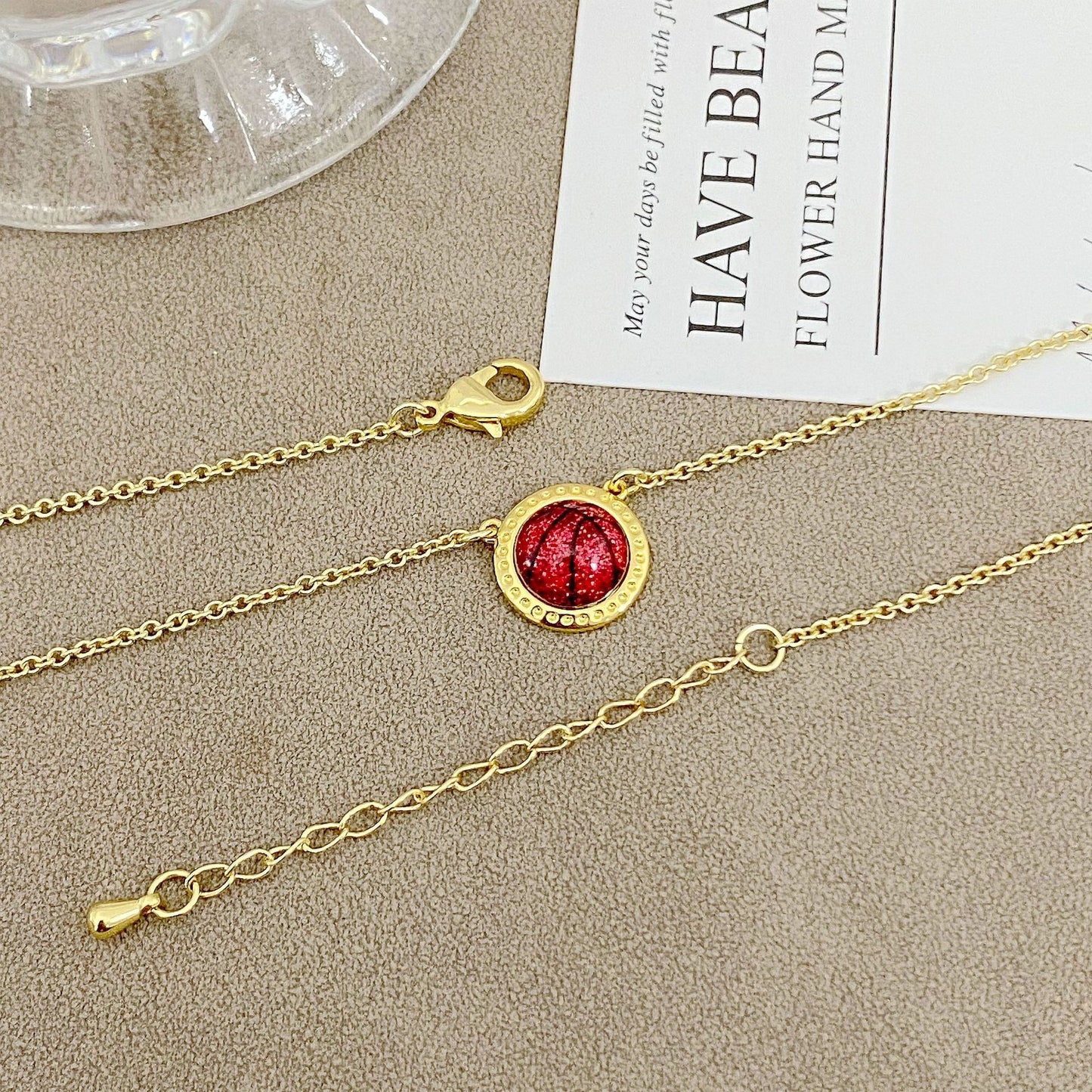 ZERRA Kendra Scott volleyball gold short pendant necklace with a delicate chain and small pendant, stylish jewelry for everyday wear.