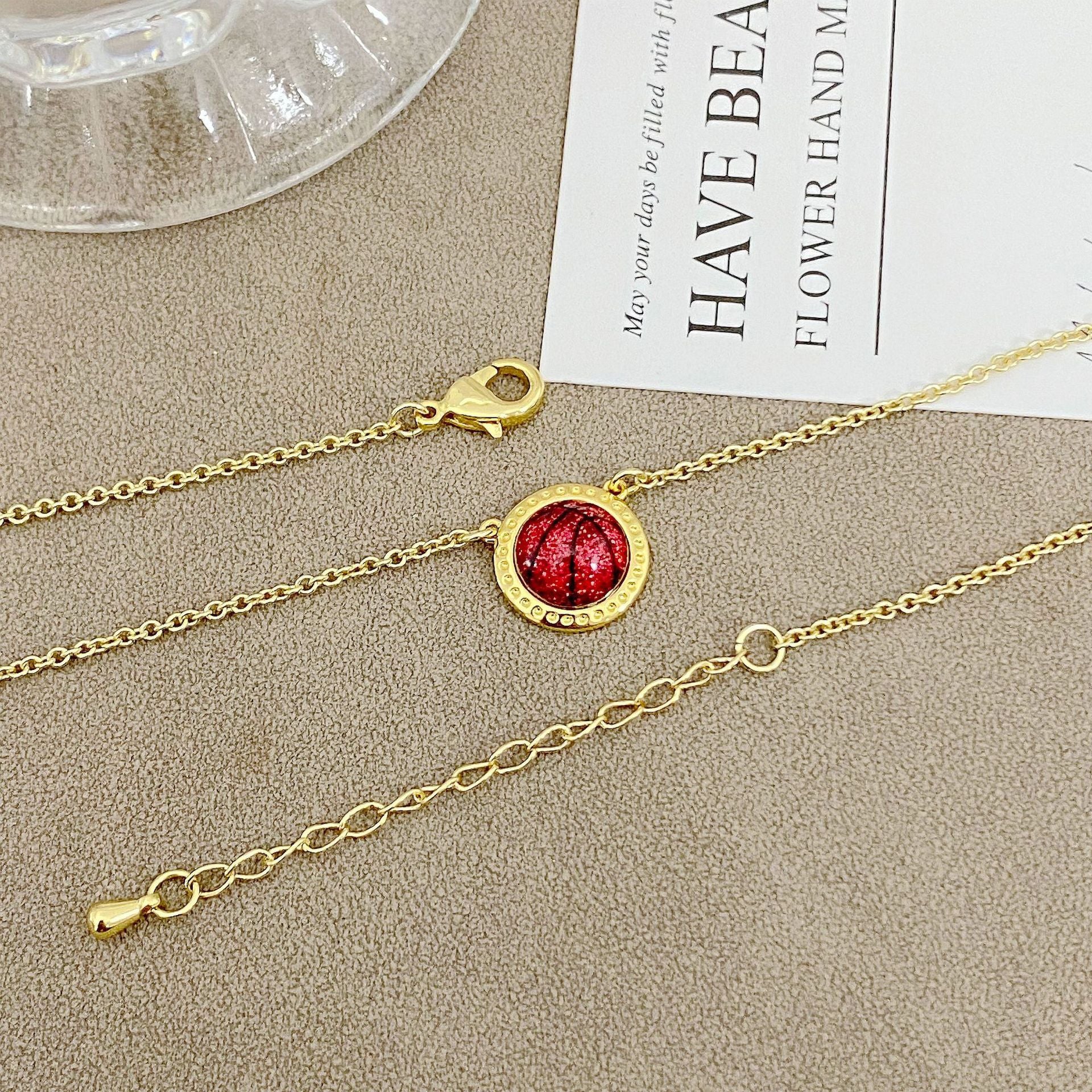 ZERRA Kendra Scott volleyball gold short pendant necklace with a delicate chain and small pendant, stylish jewelry for everyday wear.