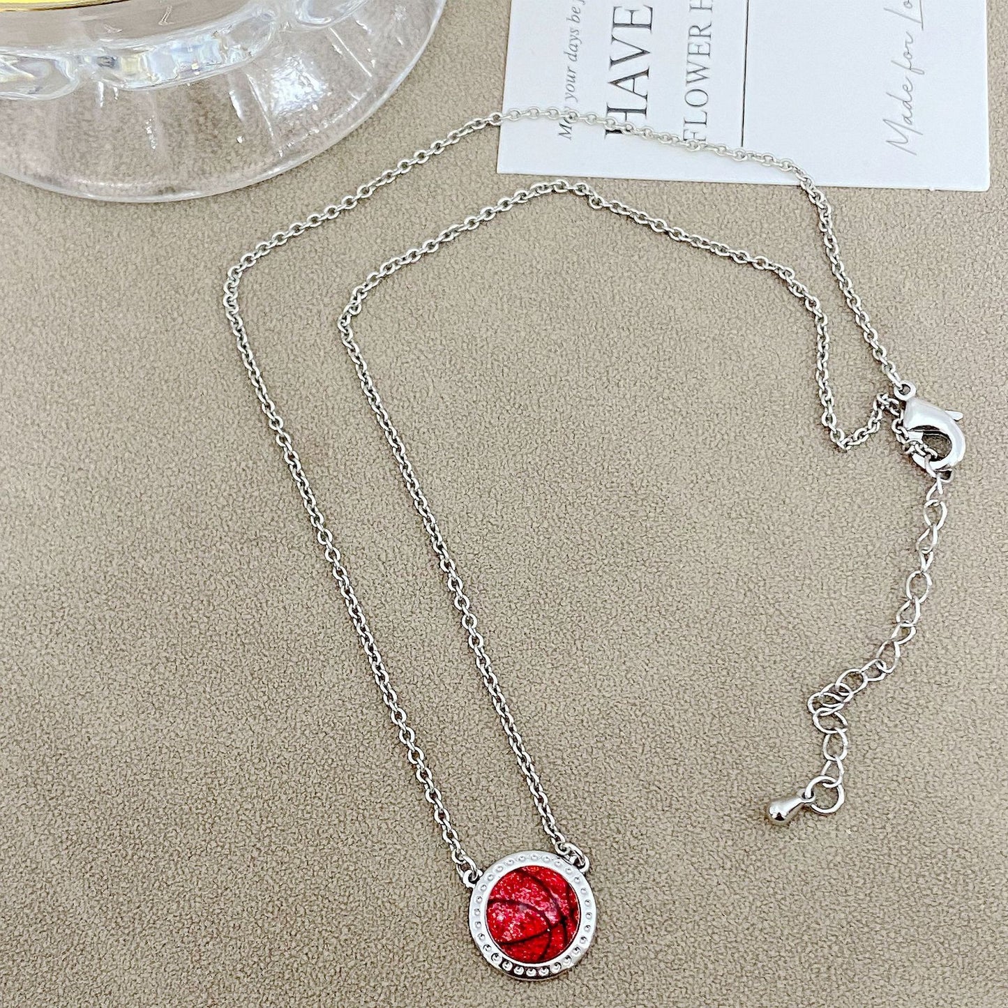 ZERRA Kendra Scott gold volleyball short pendant necklace featuring a delicate chain and sporty pendant design.