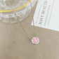 ZERRA Kendra Scott gold short pendant necklace with a volleyball-shaped charm on a delicate chain.