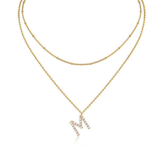 High-definition shot of both necklaces laid flat together on pure white background, arranged to show the layered effect.