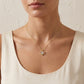 classic-gold-pear-moissanite-open-heart-necklace-lifestyle