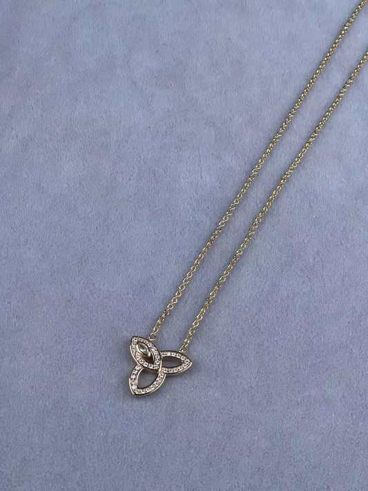 “Lily Cluster by Harry Winston diamond pendant necklace flat lay”