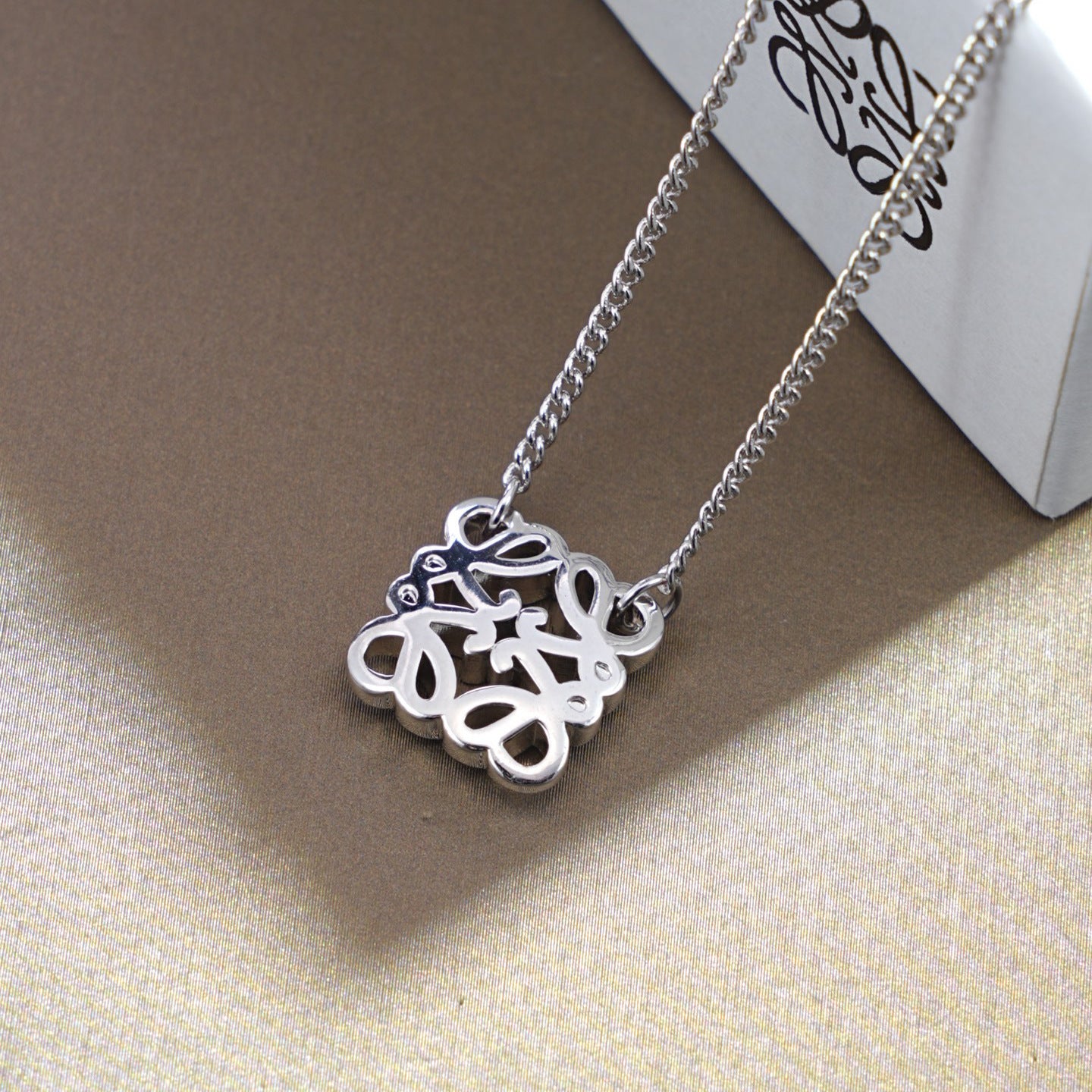  Macro shot from the side, showcasing the pendant's rounded, convex profile and depth.