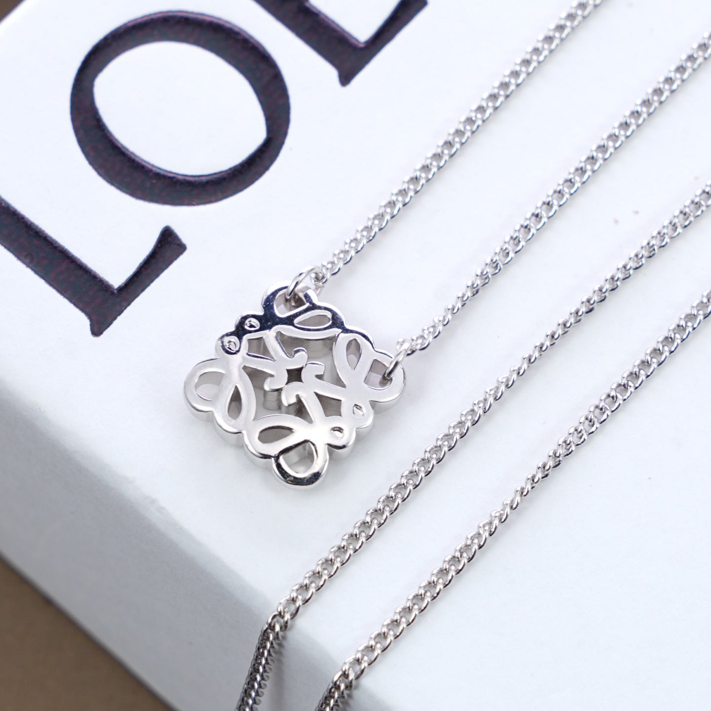  Macro shot from the side, showcasing the pendant's rounded, convex profile and depth.