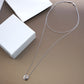 Clean, well-lit shot of the necklace, ideally at an angle that highlights the three-dimensional dome shape of the pendant.