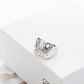 Clean, angled shot of the ring on a finger or stand, showcasing the dramatic 3D dome shape of the pendant.