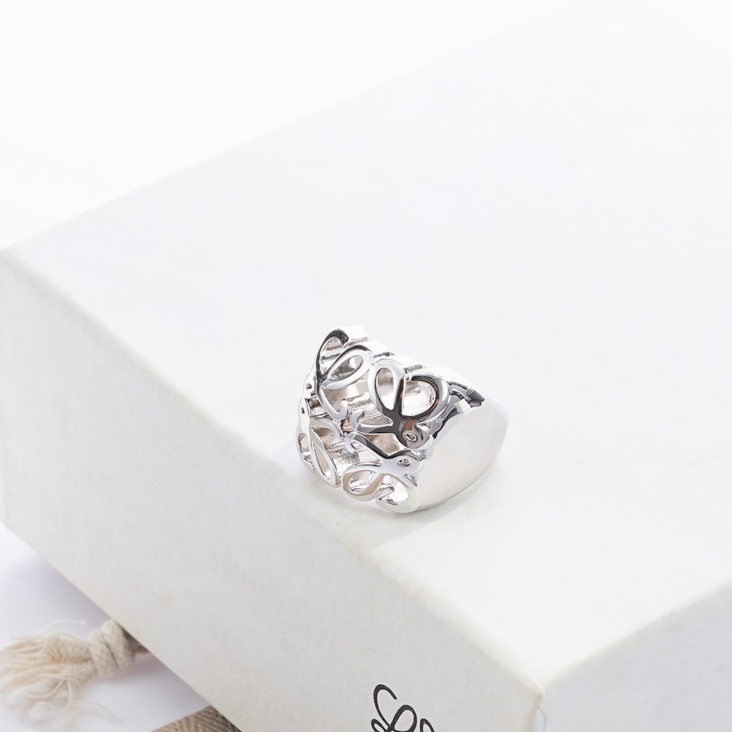Clean, angled shot of the ring on a finger or stand, showcasing the dramatic 3D dome shape of the pendant.
