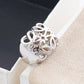 Clean, angled shot of the ring on a finger or stand, showcasing the dramatic 3D dome shape of the pendant.
