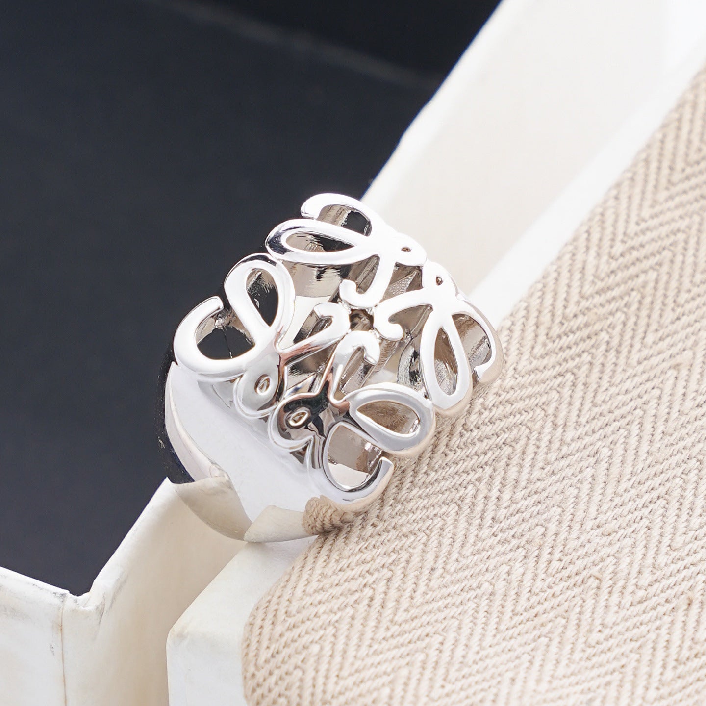 Clean, angled shot of the ring on a finger or stand, showcasing the dramatic 3D dome shape of the pendant.